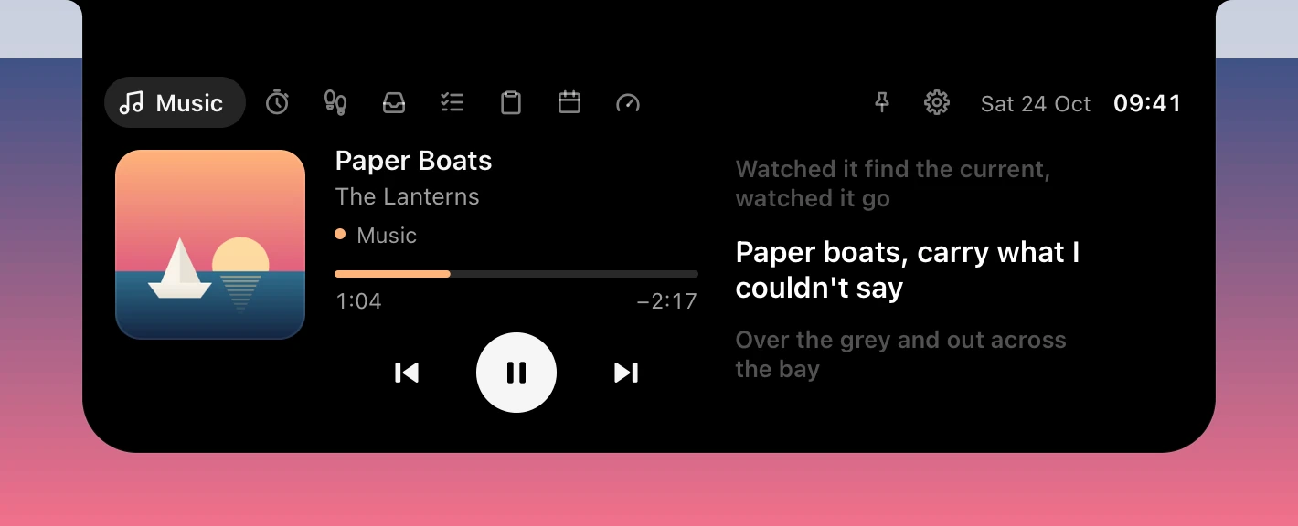 The open island hanging below a MacBook's notch: the Music page with synced lyrics